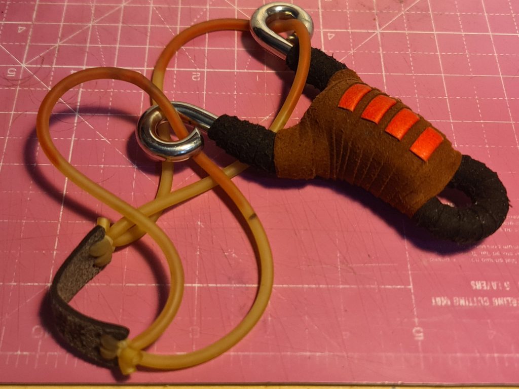 A Chinese bent-steel slingshot called BUMPED BELLY, with a GZK tube-in-tube cocktail bandset